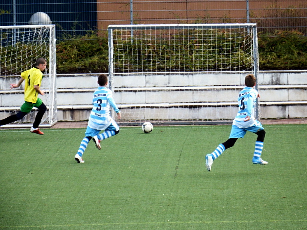 Young footballers playing a soccer match