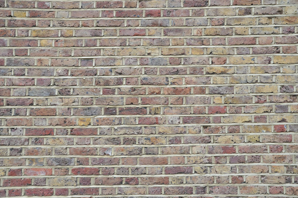 Close-up of a red brick wall texture