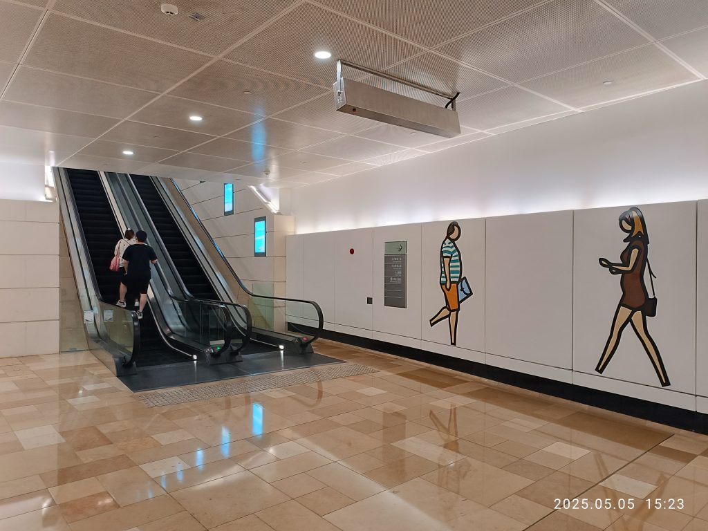 Pedestrian subway tunnel with escalators at a city station