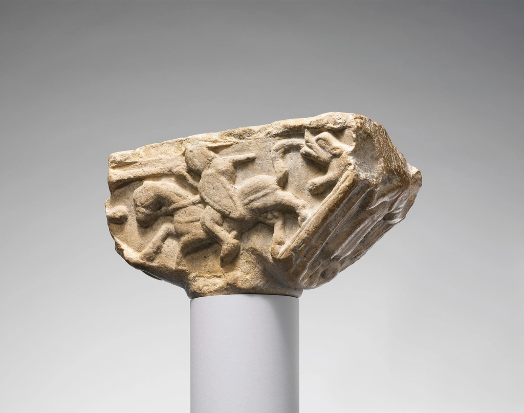 Carved stone capital depicting an armoured knight